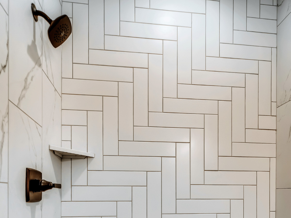 White wall tiled shower walls with bronze fixtures
